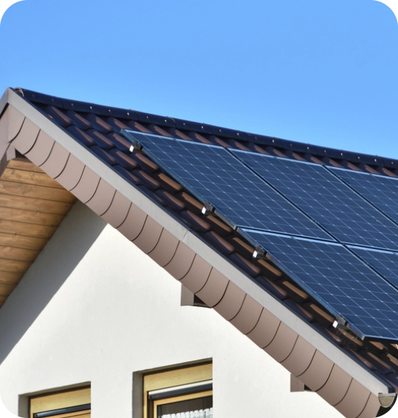 Top of a white house with solar panels