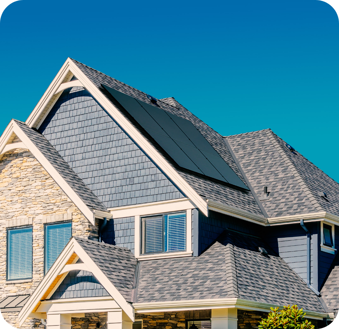 House with solar panels and blue siding