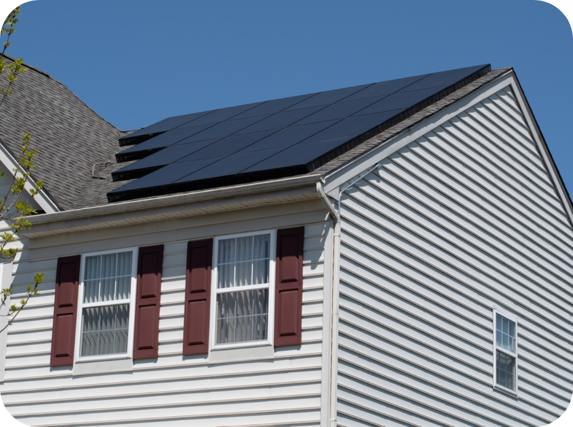 Solar panels on house with white siding