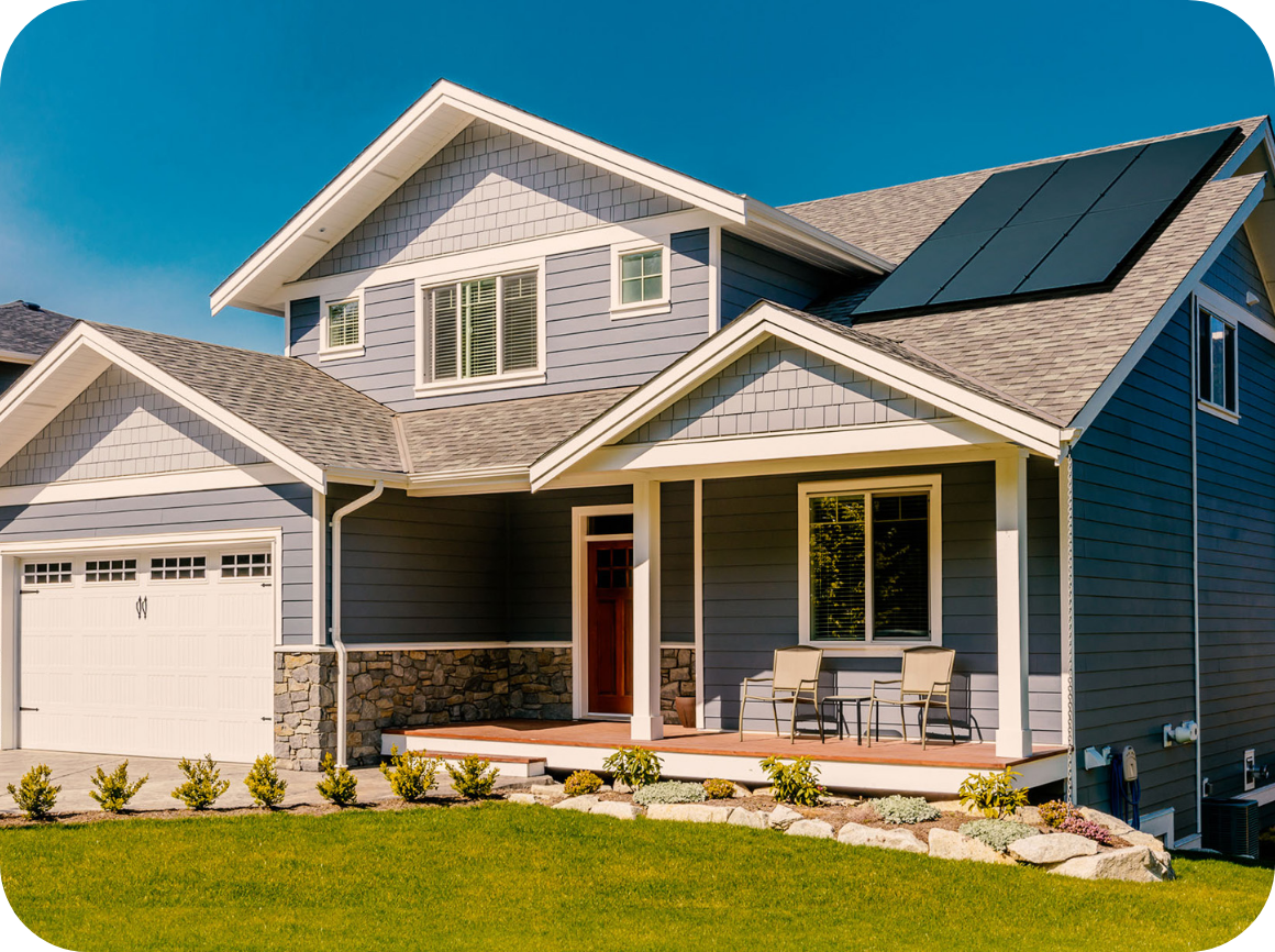 House with solar panels, porch, blue siding, and garage