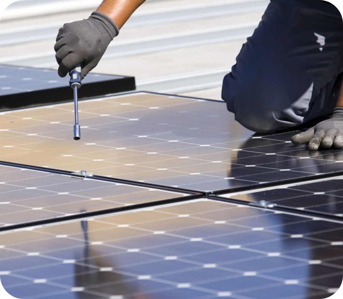 Maintenance worker working on solar panel