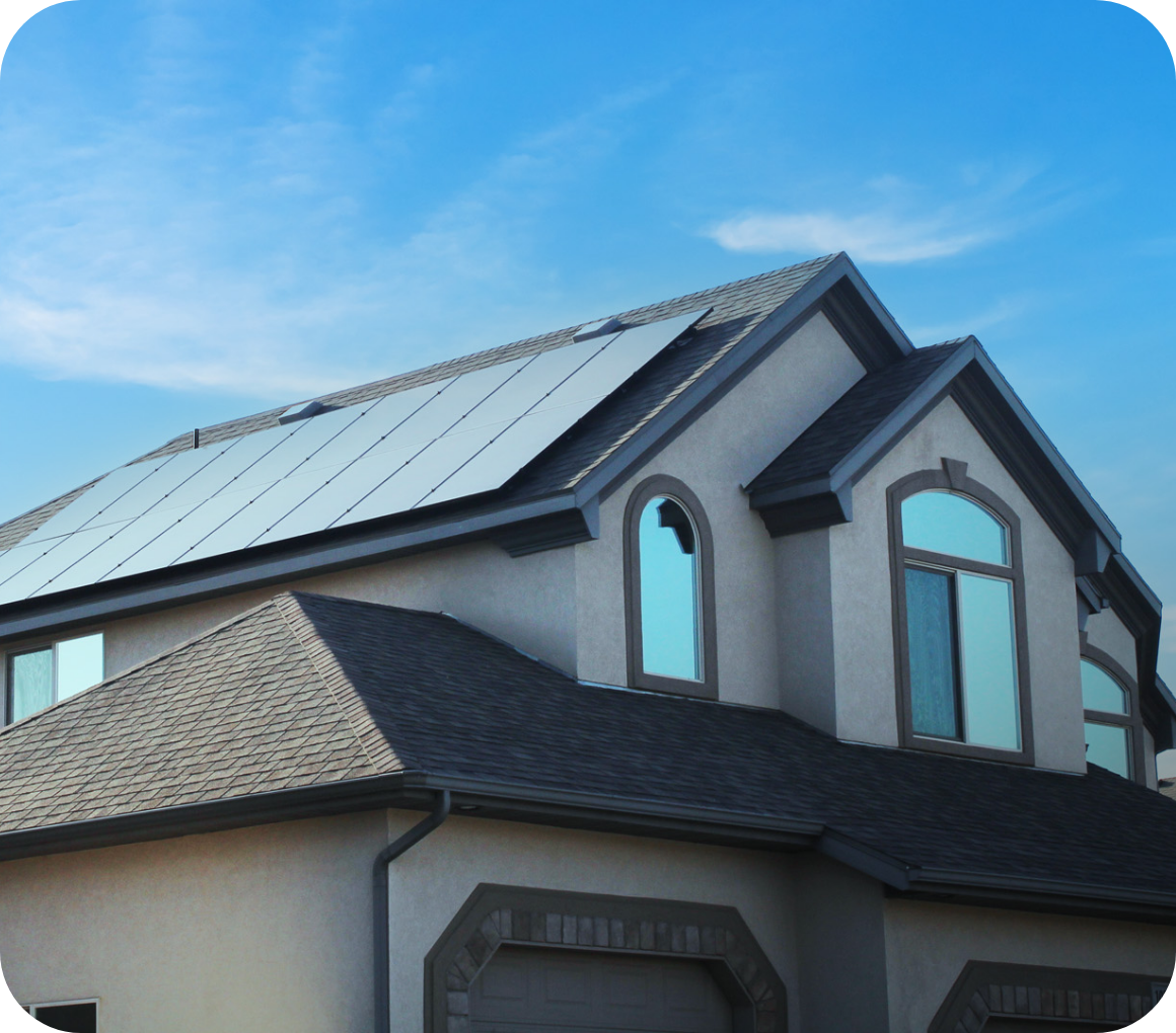 2 story house with solar panels and a garage