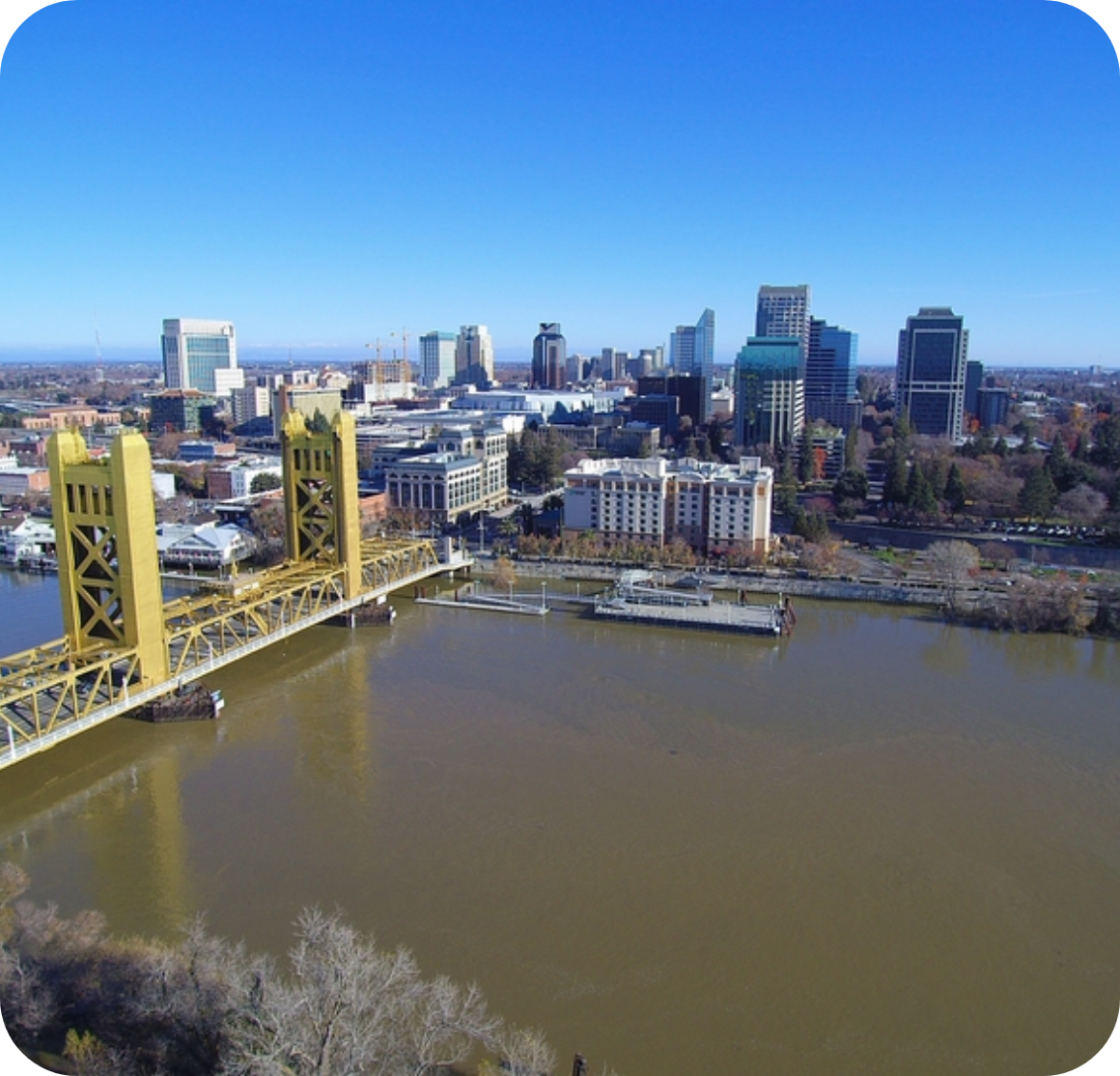 Aerial view of city with river and bridge