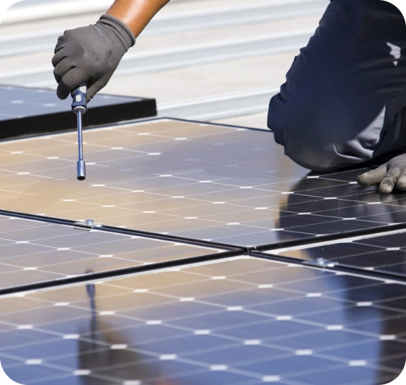 Solar maintenance technician working on a solar panel