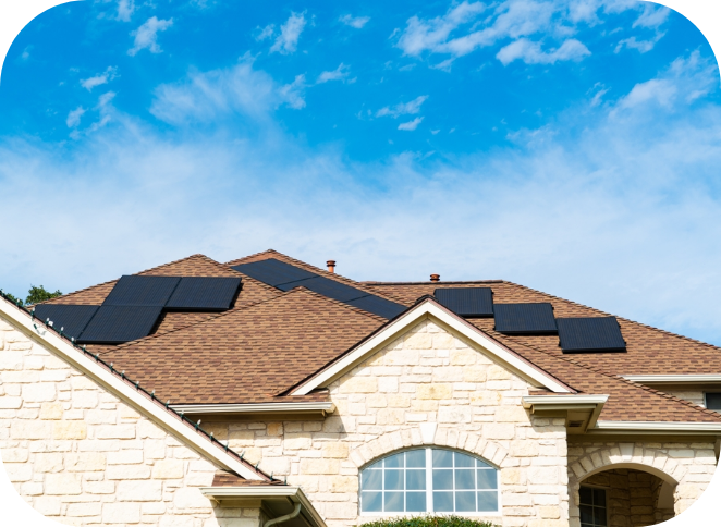 White brick house with brown shingles and solar panels