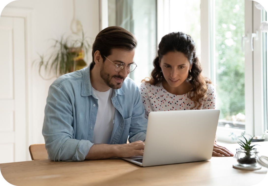 Couple on laptop at a computer