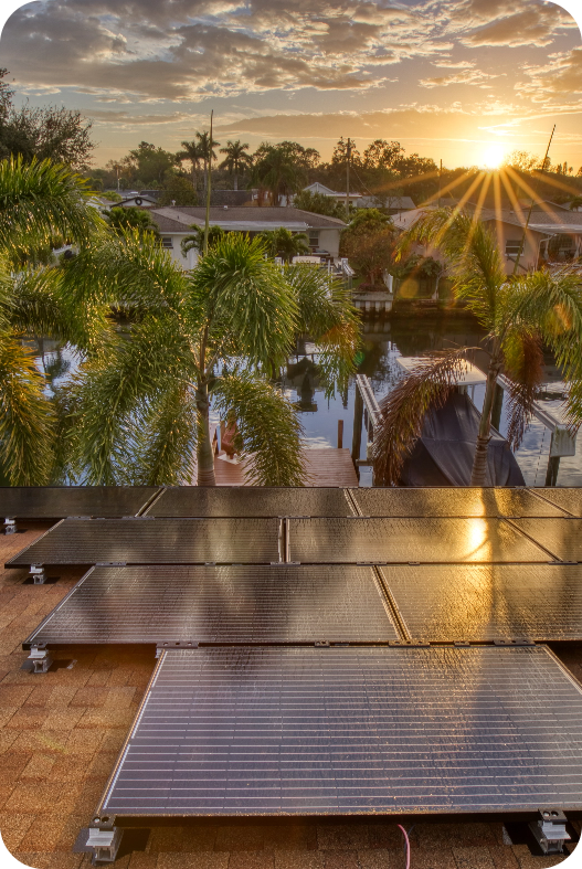 rooftop view from a home with solar panels looking out to the sunset