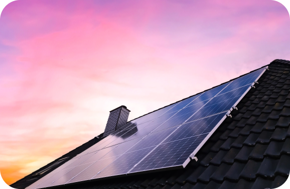 Purple skies reflecting off of a solar panel