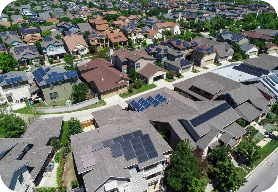 Neighborhood sky view of multiple house with solar panels