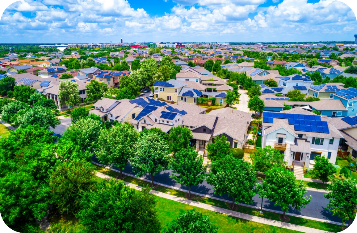 Neighborhood view of multiple houses with solar panels