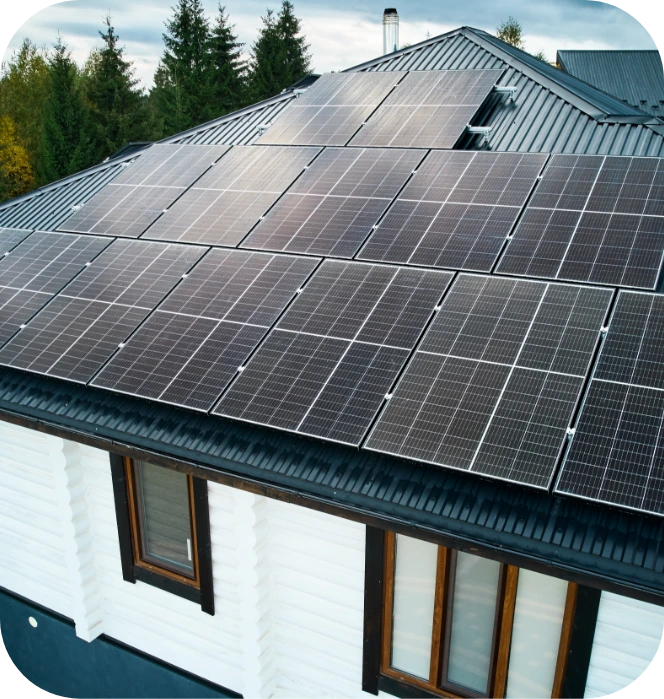 House with white log siding and solar panels