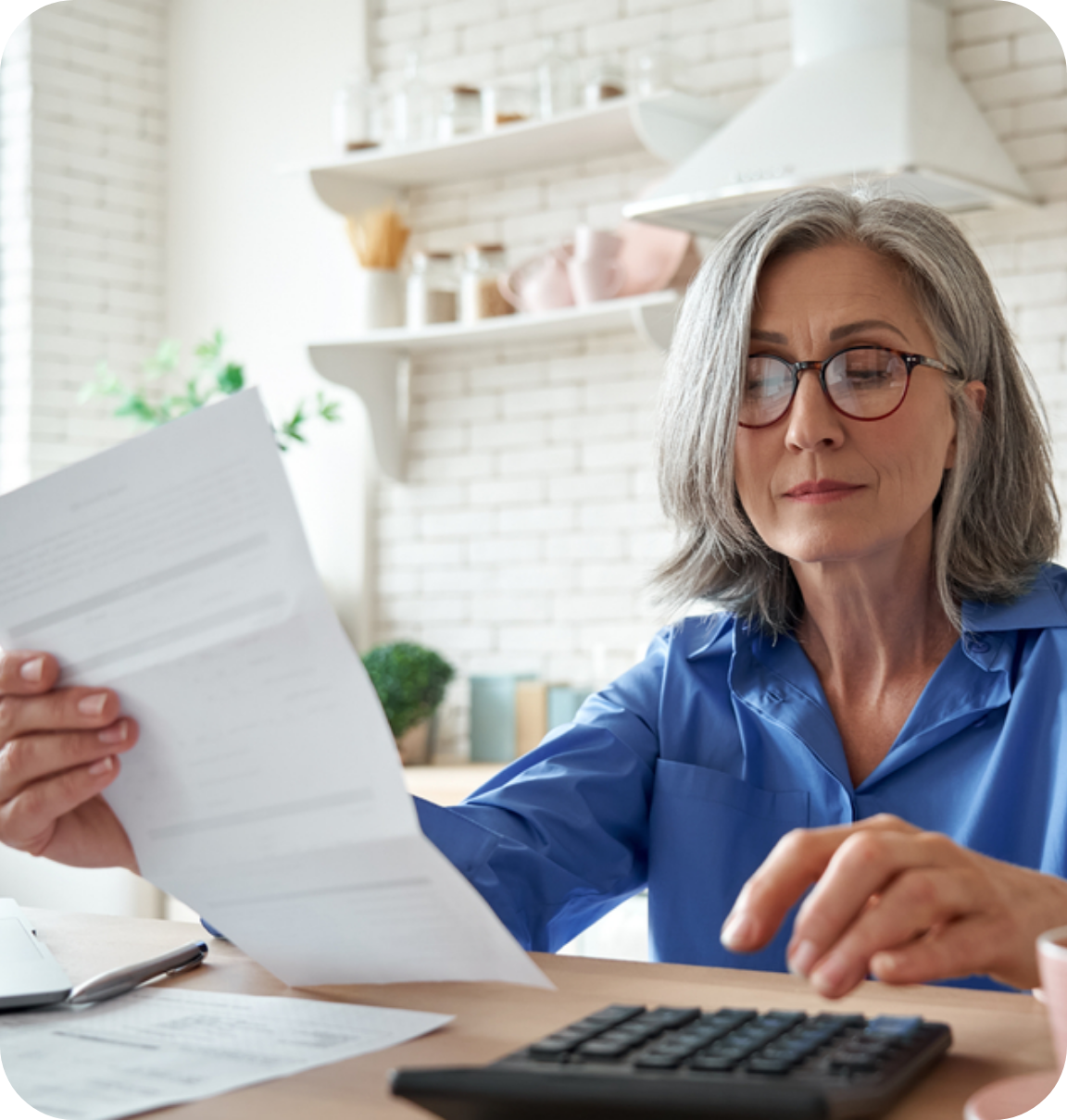 a woman calculating a bill invoice